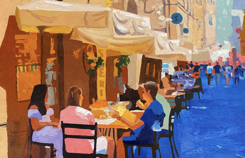 A colorful impressionistic painting by Michael Anderson titled Shall We Have Lunch, measuring 11 x 17 x 1.5 inches. The artwork depicts an outdoor café scene with people dining under large beige umbrellas. The background features a bustling street filled with pedestrians, painted in vibrant blues, pinks, and warm earth tones. The artist's signature is visible in the bottom right corner.